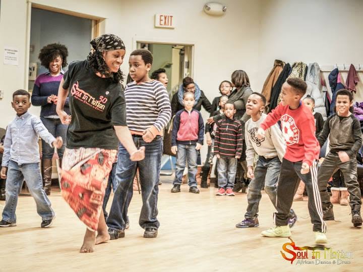 Pam with children dancing